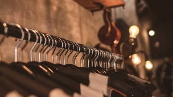 photo of black clothes on hangers
